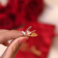 model holding silver, rose gold, and gold Engraved Animal Initial Rings