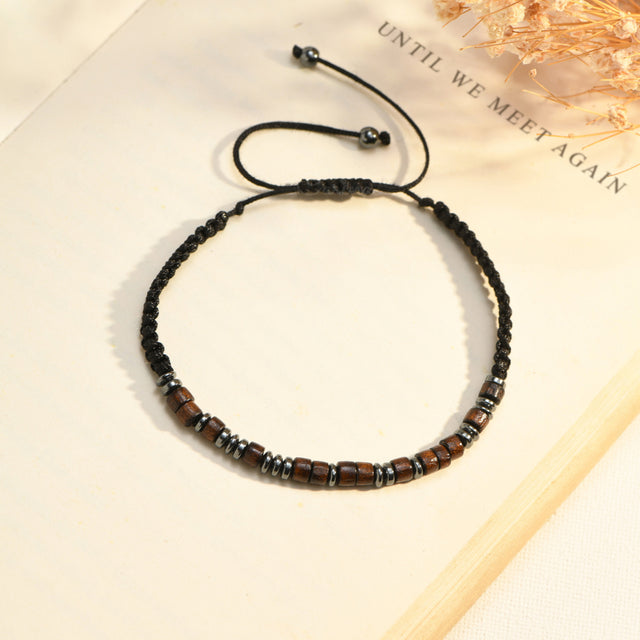 Creative image of the UNTIL WE MEET AGAIN morse code bracelet on a book page