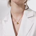 model wearing the Dainty Initial Disc Necklace