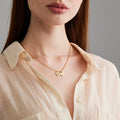 model wearing the Dainty Initial Disc Necklace