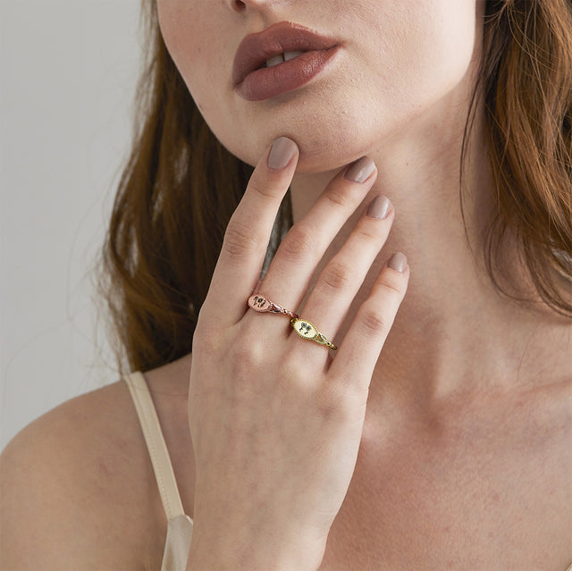 model wearing Personalized Multiple Birth Month Flower Ring in rose gold and gold