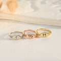 silver, rose gold, and gold Personalized Multiple Birth Month Flower Rings on white canvas