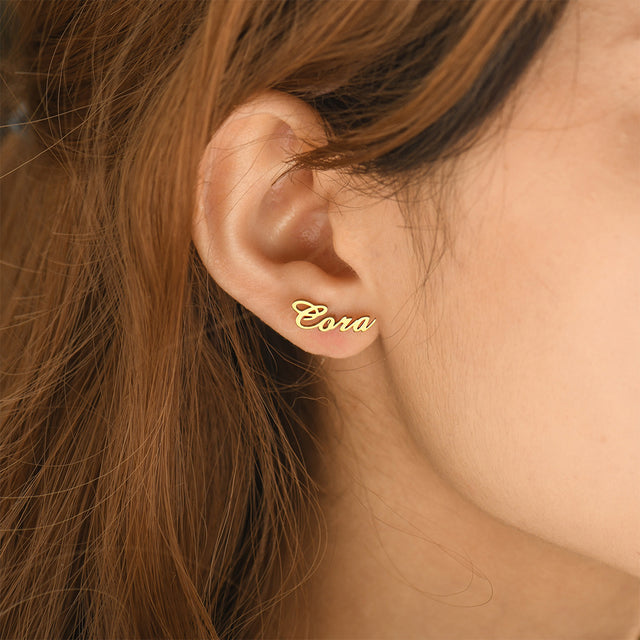 model wearing the gold variant Personalized Name Stud Earrings