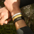 model wearing silver, gold, and black Personalized Steel Band Bracelets