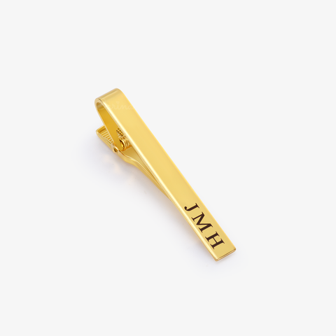 gold Personalized Tie Clip with initials on white background