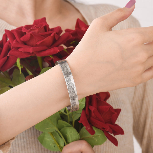 Model wearing a I Love You Till My Last Breath Bracelet while holding a flower