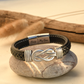 Mother and Son Forever Linked Together Braided Leather Bracelet on top of a stone