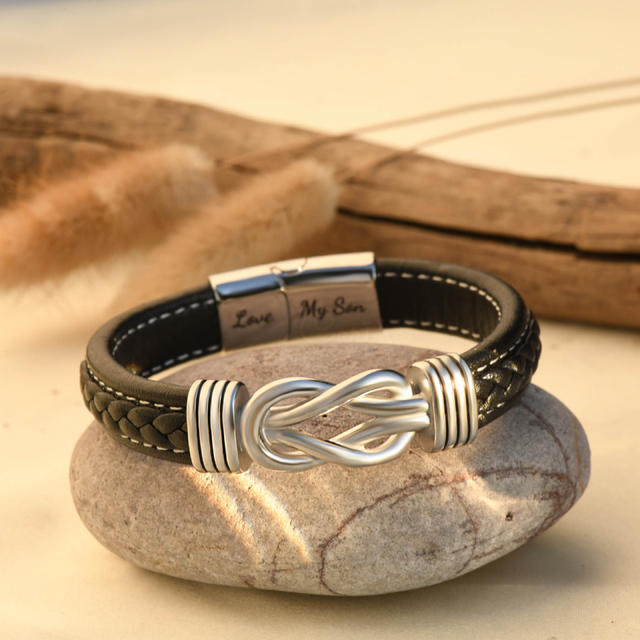 Mother and Son Forever Linked Together Braided Leather Bracelet on top of a stone