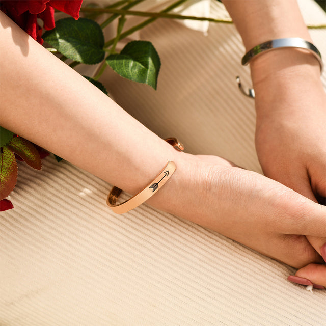 model wearing silver and rose gold Straighten Your Crown Personalizable Cuff Bracelets