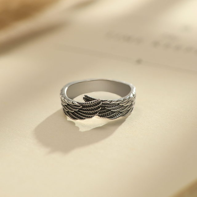 Photo of Guardian Angel Wing Ring on top of a book