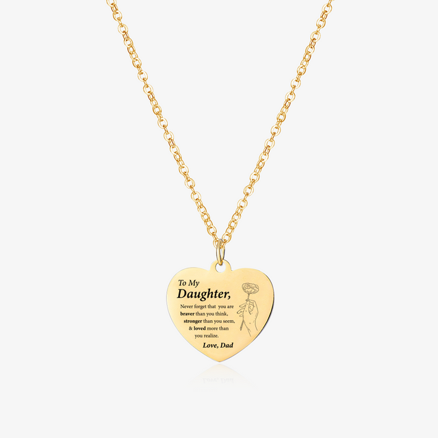 gold engraved heart necklace on white background