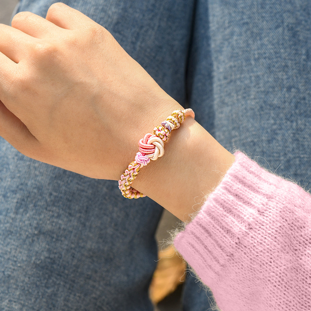 Model wearing “Grandmother & Granddaughter Forever Linked” Peach Blossom Knot Bracelet