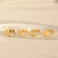 Lifestyle image of Hug From Heaven Personalized Initial Rings with individual initials V, A, O, and N.