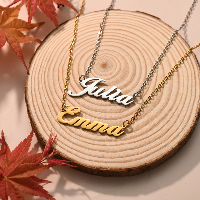 Personalized Emma and Julia Quill Name Necklace on a wooden canvas.