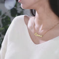 Personalized Emma Quill Name Gold Necklace model video loop.