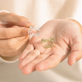 silver and gold colored Personalized Dual Name Ring on model's hands